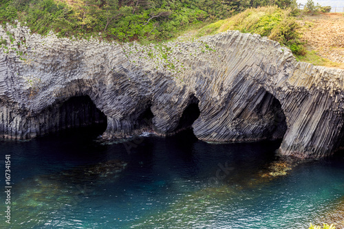 Basalt rocks in Nanatsugama, Kyushu Japan photo