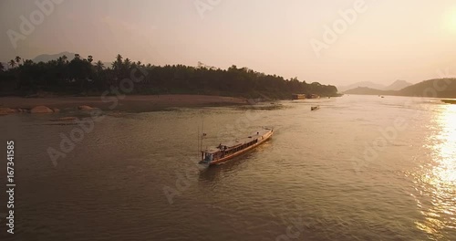 Traditional Long Boat Cruising on The Mekong River, Luang Prabang, Laos

