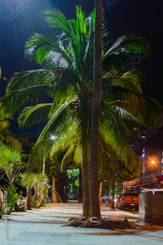 Promenade walkway along Jomtien Pattaya Beach at night time after reconstruction. photo