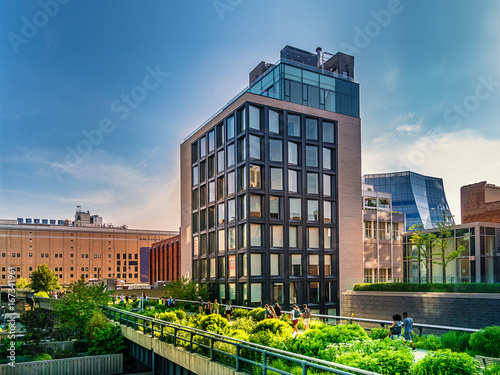 The High Line Park in Manhattan New York. The urban park is popular by locals and tourists built on the elevated train tracks above Tenth Ave in New York City photo