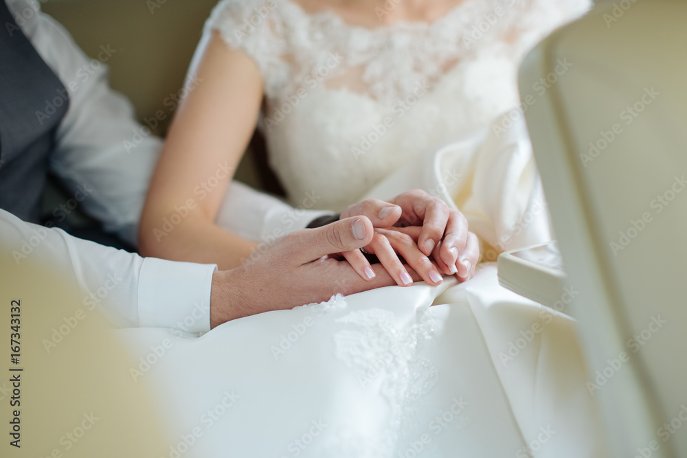 Hands of the groom touch the fingers of the bride, her palms in his palms Hands of the groom touch the fingers of the bride, her palms in his palms