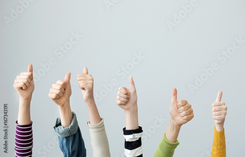 Group of people thumps up
