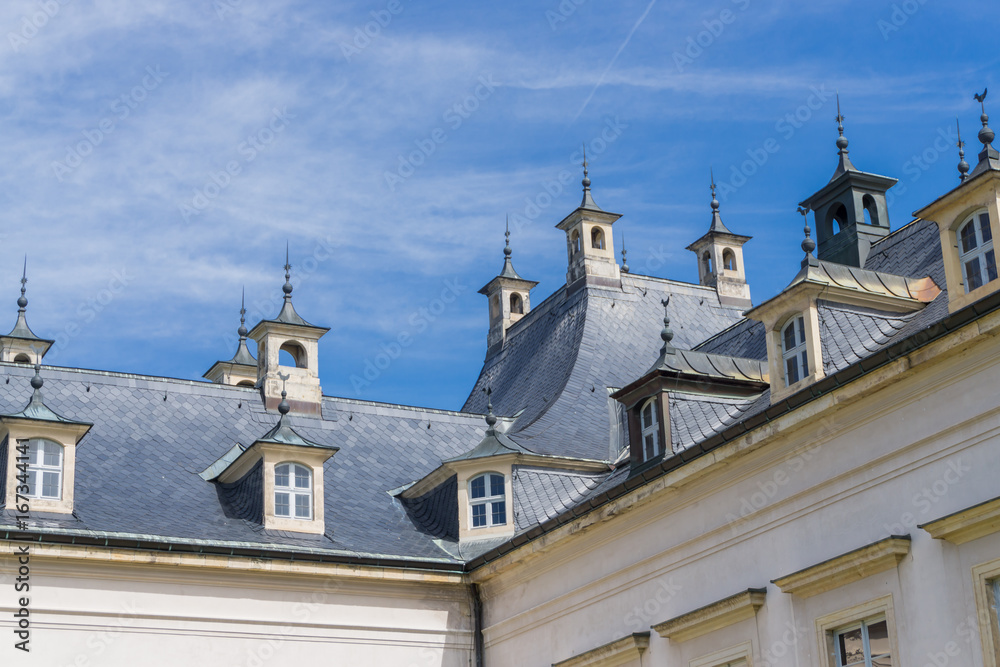 Roof of Pillnitz Castle, Dresden, with windows and many small chimneys, crenelations