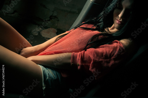 Sexy brunette driving a car, in lingerie
