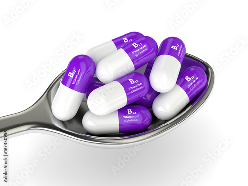 3d rendering vitamin B12 pills on spoon photo