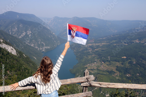 little girl with a Serbian flag on the viewpoint Banjska stena Tara mountain photo