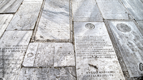 Tombstones used as floor tiles at the Monastery of the Mother of God, Istanbul photo