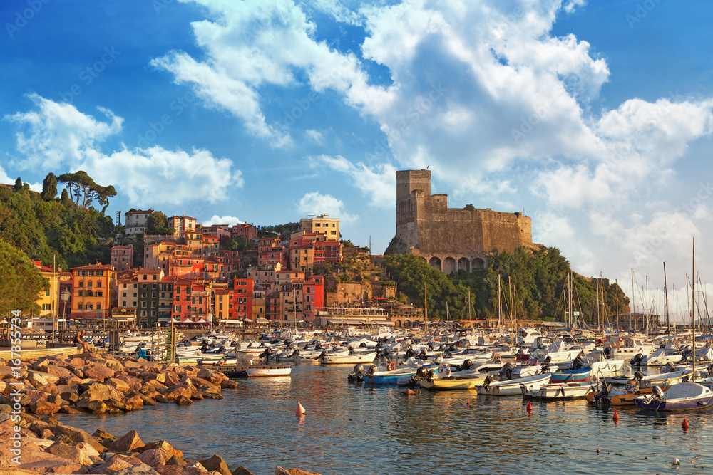 View of castle of Lerici and gulf of Lerici. Colorful building on harbour. Beautiful small city Lerici, Italy, Liguria. Poet's bay at sunset.