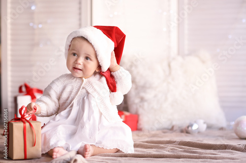 Cute little baby with Santa...