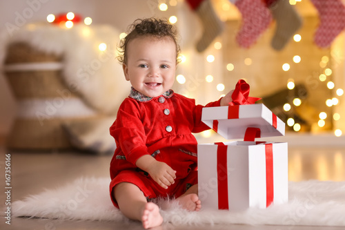 Cute little baby with gift ...