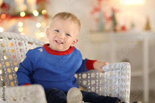 Cute little boy sitting in ...