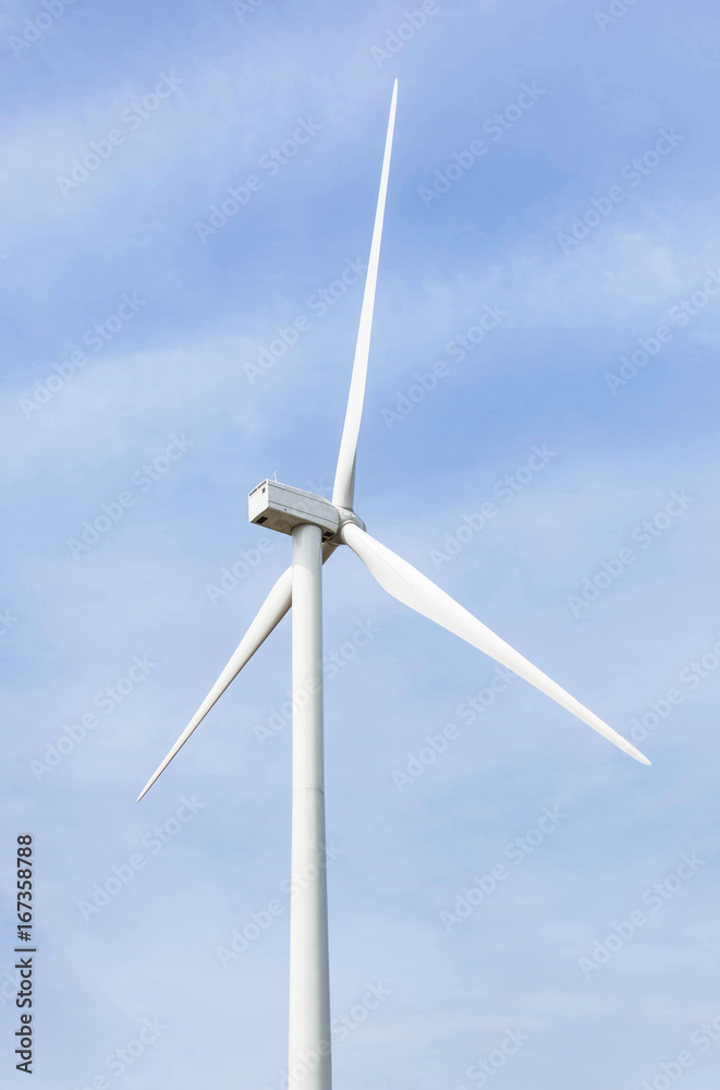 white wind turbines generating electricity in wind power station under blue sky background white wind turbines generating electricity in wind power station under blue sky background