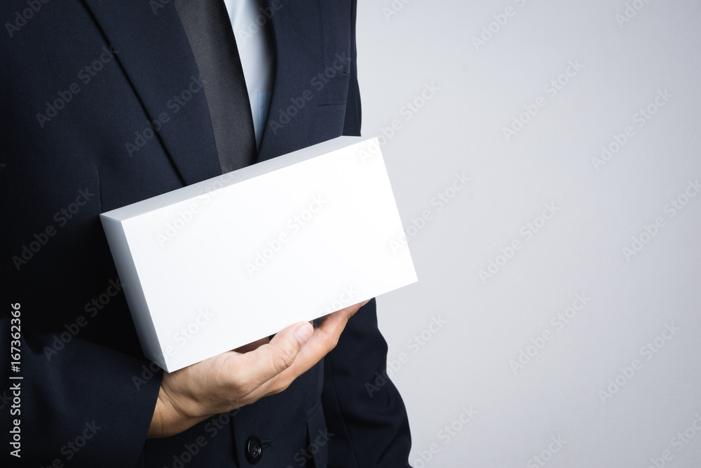 Business man hand holding blank white box give gift Business man hand holding blank white box give gift