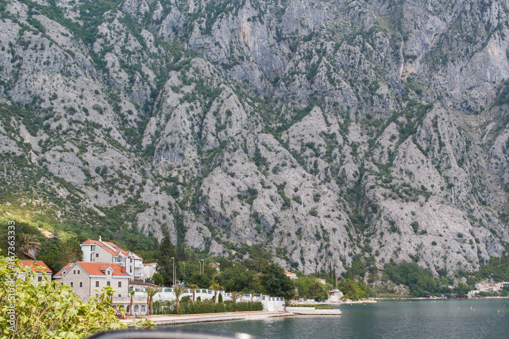 Fototapeta premium House by the sea at the slope of the mountain