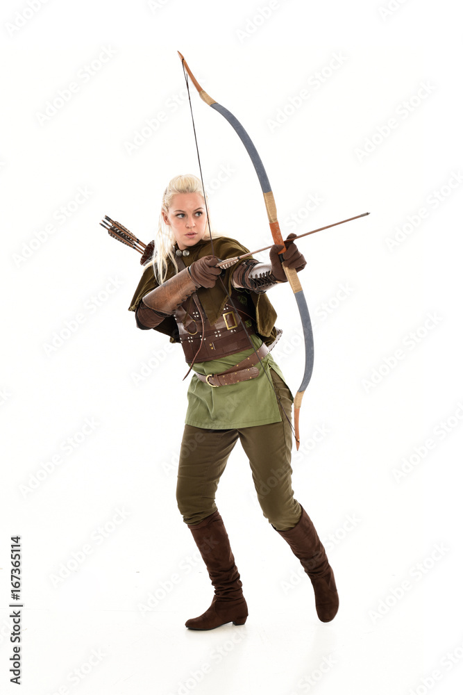 full length portrait of a blonde girl wearing green and brown medieval costume, holding a bow and arrow. isolated on white background. full length portrait of a blonde girl wearing green and brown medieval costume, holding a bow and arrow. isolated on white background.