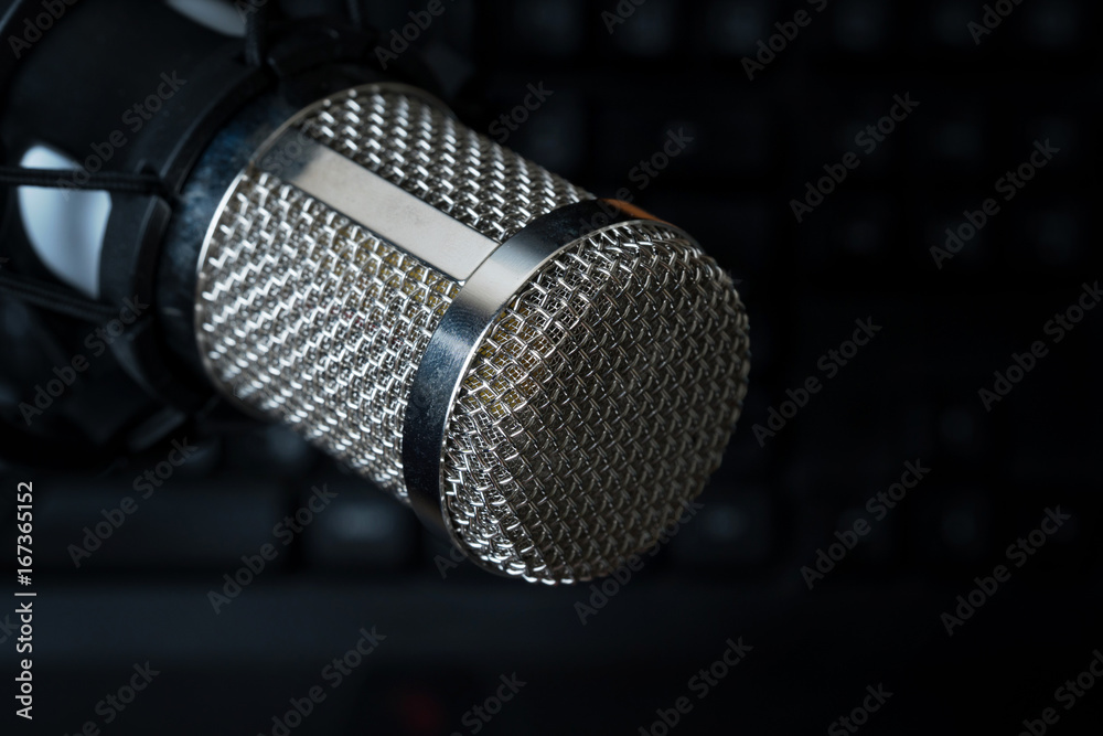 Professional condenser studio microphone over the keyboard Stock Photo Adobe Stock