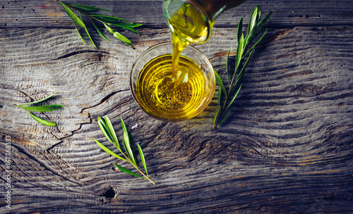 Olive oil with olive twig