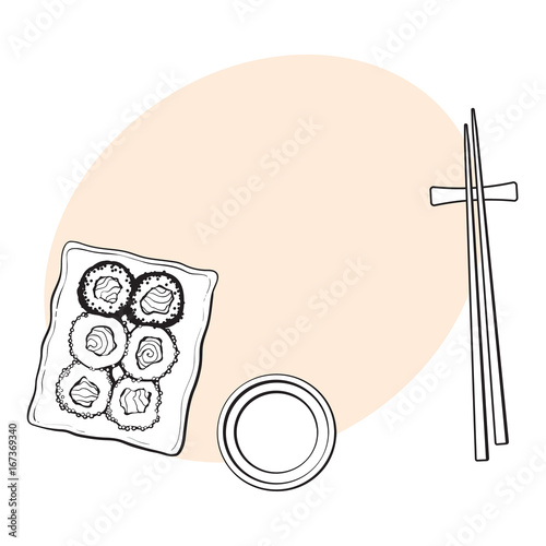 Plate of Japanese sushi, rolls, chosticks and soy sauce bowl, top view hand drawn, sketch style vector illustration with space for tex. Sushi serving plate, chopsticks, soy sauce photo