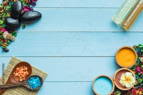 spa and massge items lay on blue wooden background