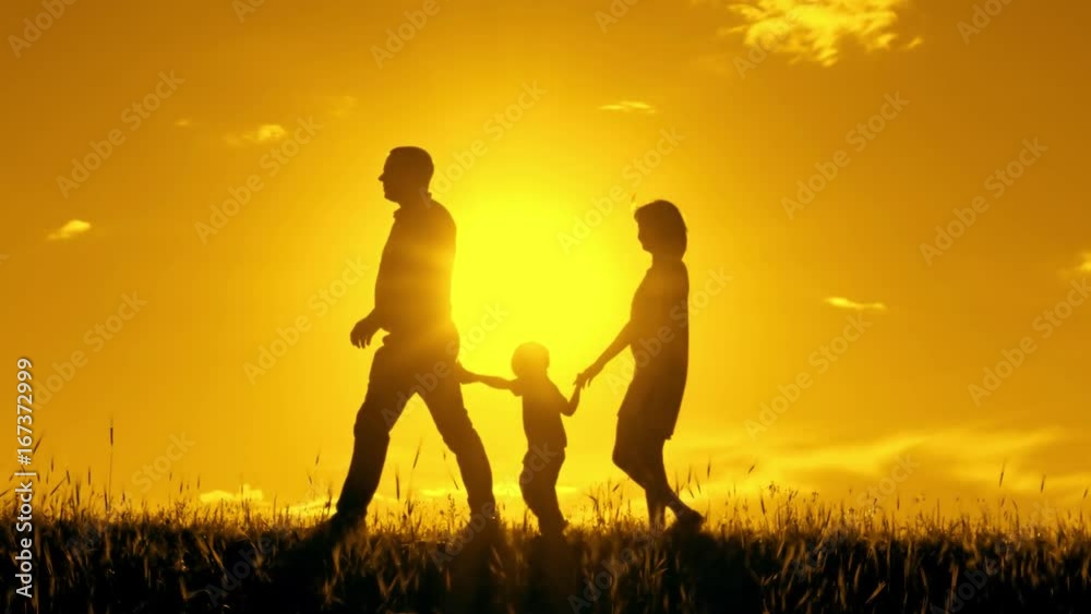 Happy family is walking holding hands one after another. Happy family is walking holding hands one after another.