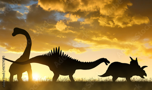 Silhouette of dinosaurs in the sunset. © vencav