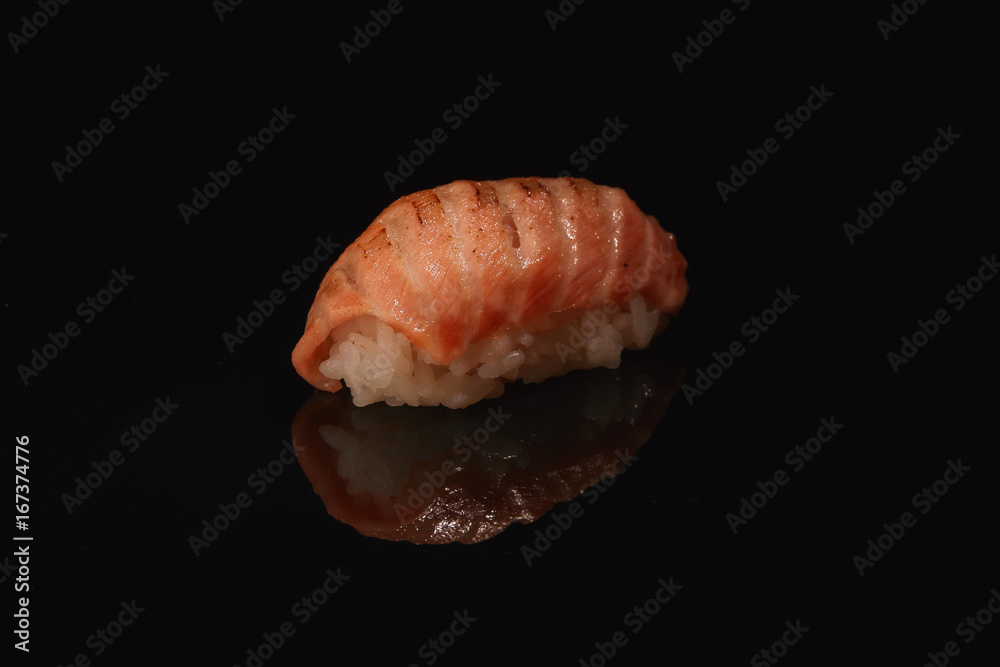 Sushi on black background with reflection Sushi on black background with reflection