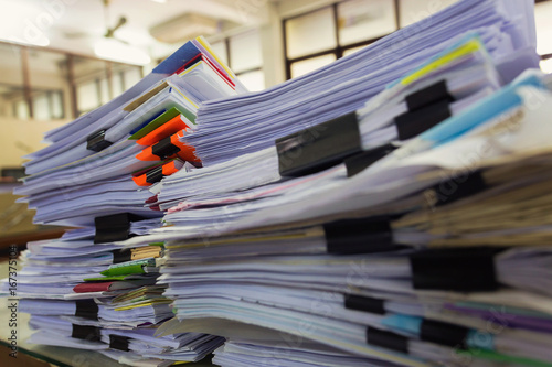 Pile of unfinished a bundle documents on office desk, Stack of business paper