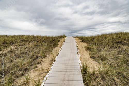 Wooden path over dunes at beach.