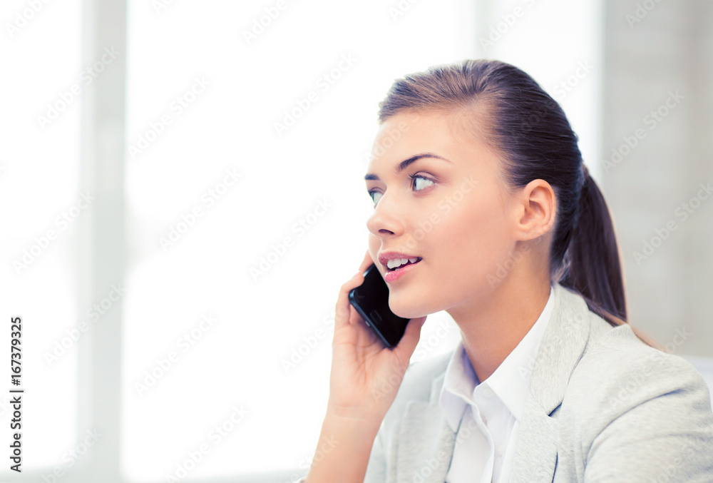 businesswoman with smartphone in office