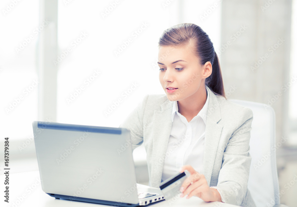businesswoman with laptop using credit card businesswoman with laptop using credit card