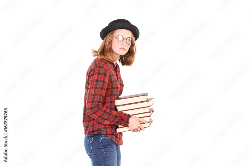 Portrait of female teenage student in hat holding stack of books Portrait of female teenage student in hat holding stack of books