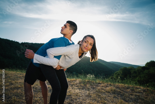 Helping him stretch out his back