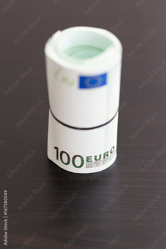 Roll of one hundred euro bills. Shallow dof Roll of one hundred euro bills. Shallow dof