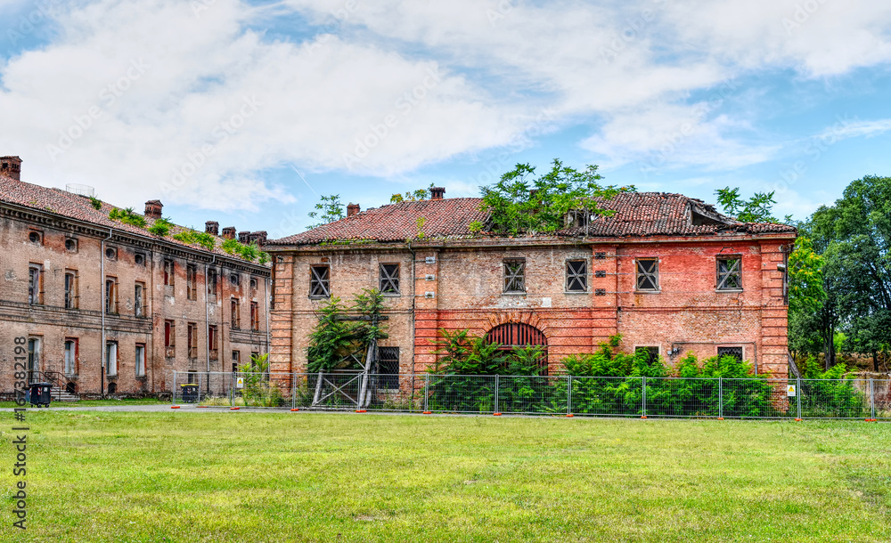Abandoned and ruined buildings of the ancient damaged Cittadella of Alessandria in Italy. HDR effect.