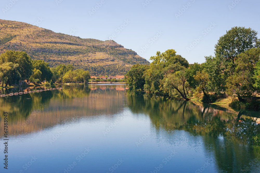 View of Trebisnjica river near Trebinje town on a summer day. Bosnia and Herzegovina, Republika Srpska View of Trebisnjica river near Trebinje town on a summer day. Bosnia and Herzegovina, Republika Srpska
