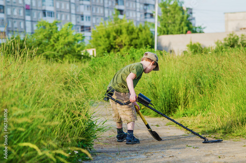  boy with a metal detector