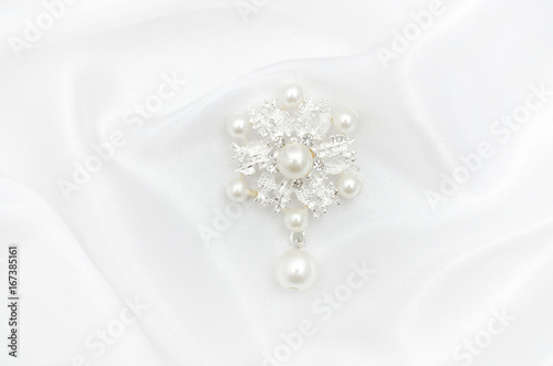 Brooch flower with pearls on silk fabric