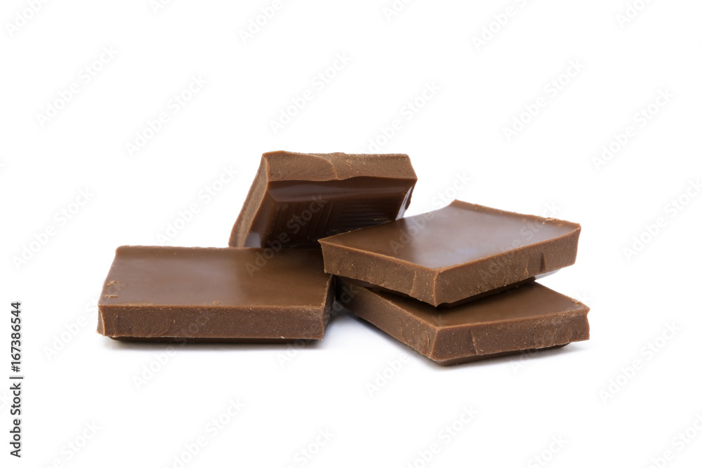 Milk chocolate pieces isolated on white background Milk chocolate pieces isolated on white background