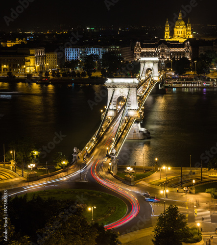 The Chain Bridge in Budapest at night with St. Stephen's Church