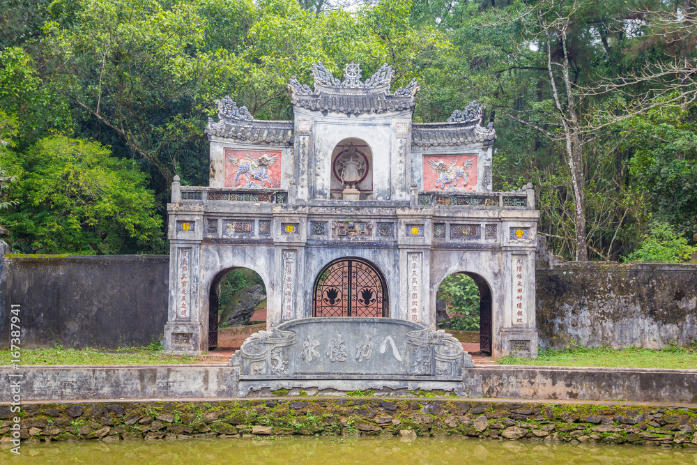 Fototapeta premium The gate of ruin pagoda in Hue Vietnam. Tu Dam pagoda