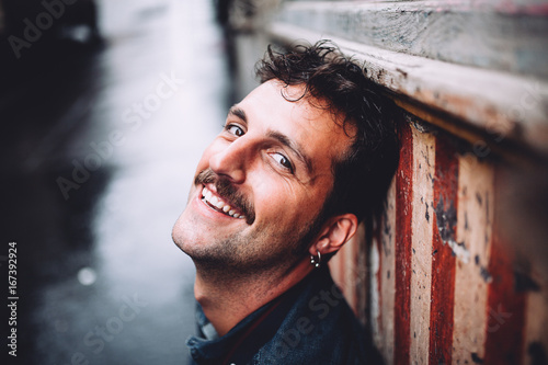Man with moustache smiling