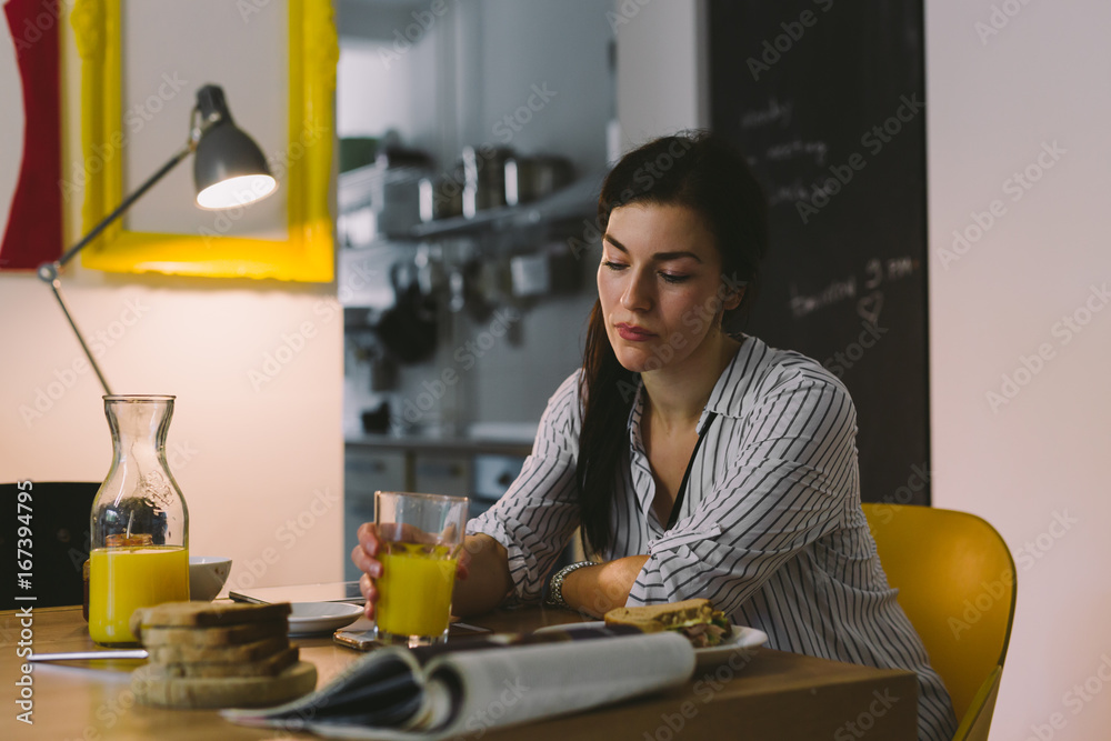 Thoughtful young woman sitting in her home. Worried woman. Thoughtful young woman sitting in her home. Worried woman.