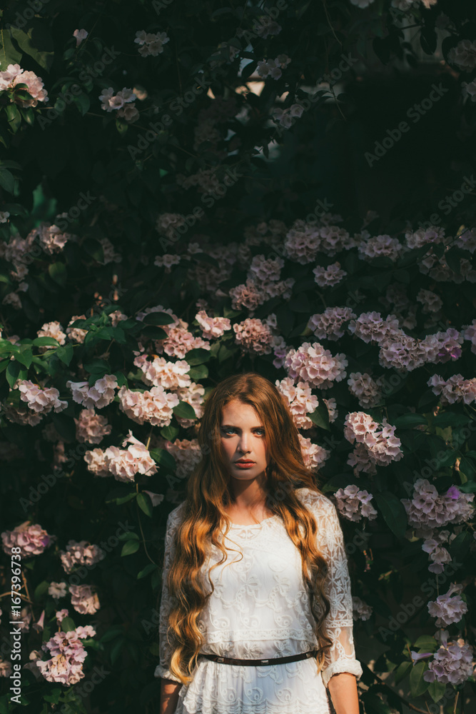 Beautiful Blue-eyed Woman in a Tropic Garden Beautiful Blue-eyed Woman in a Tropic Garden