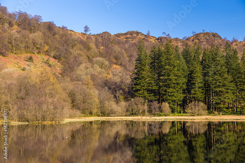 Yew Tree Tarn, small lake in the English Lake District situated in between the towns of Ambleside and Coniston, Cumbria, England. © Tomasz Wozniak