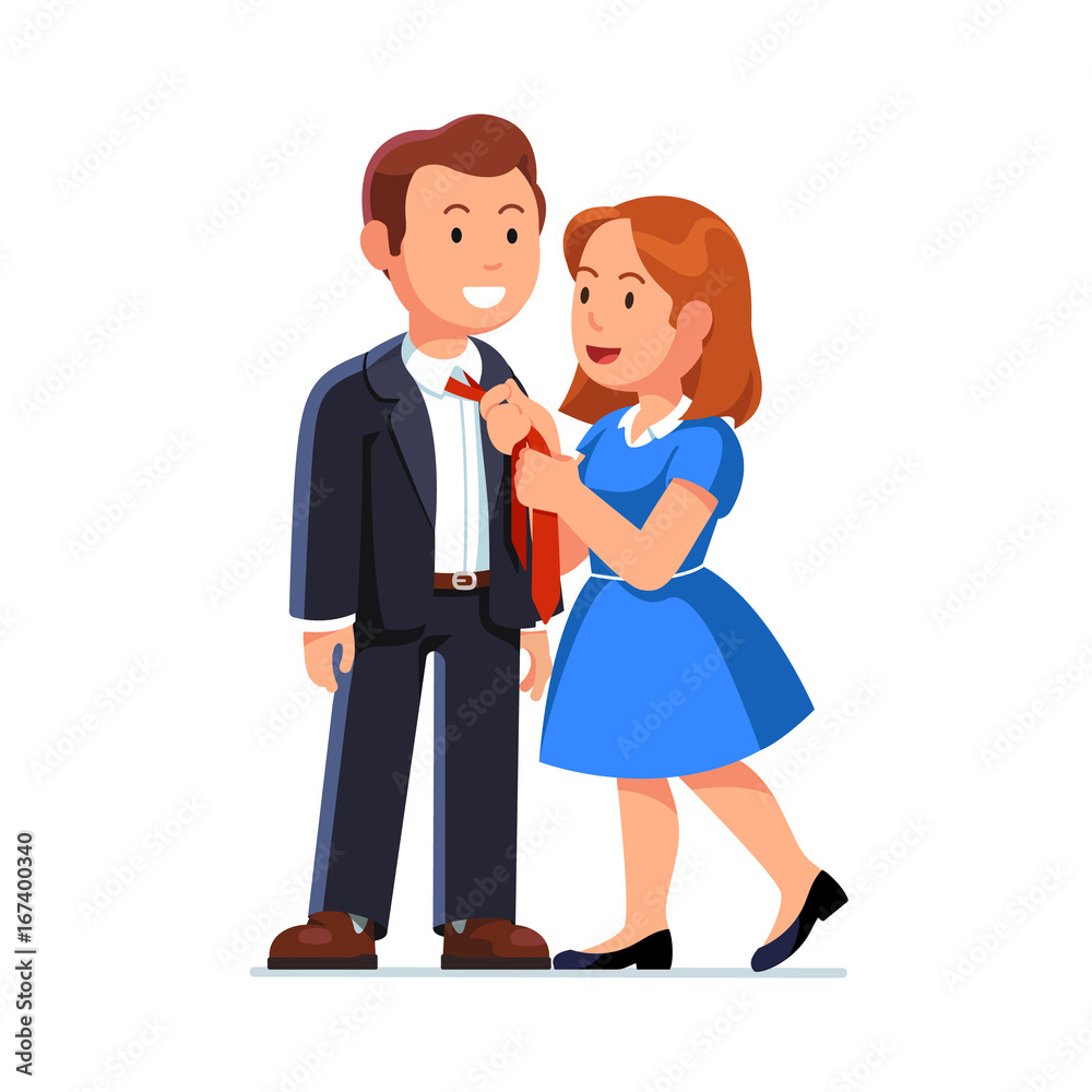 Wife in dress knotting husbands neck tie