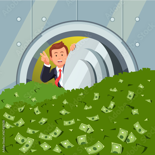 Businessman peeking through bank vault door