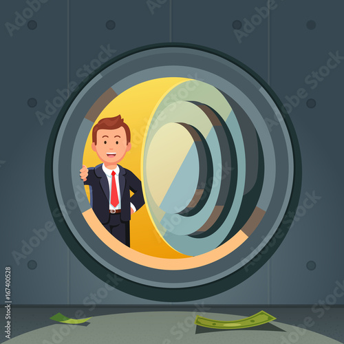 Businessman peeking through bank vault door