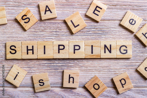 Shipping Word Written In Wooden Cube. Wooden Cube background