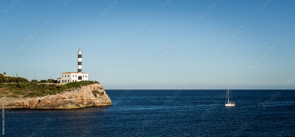 Portocolom Lighthouse at Punta de ses Crestes, Portocolom, Mallorca. Spain.