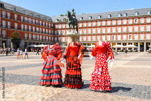 sevillana traditional dress at madrid plaza mayor, spain photo
